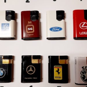 Vintage lighters. Metal lighters with logos of automobile brands